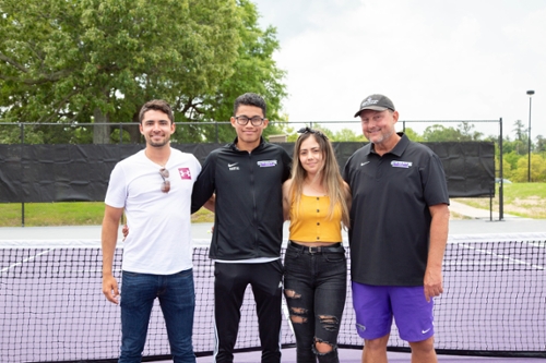 MGA Knights tennis players and their coach at the ribbon cutting event.