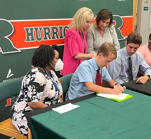 Rutland High School seniors Parker Flury and Carter Robinson signing to join the next class of Project SEARCH at MGA.