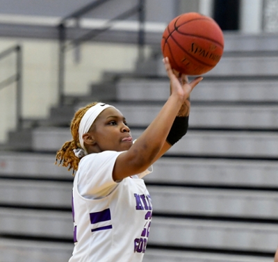 Knight's womne's basketball player making a shot in a game.
