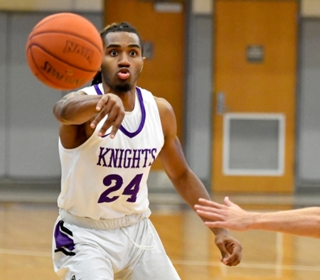 Knights men's basketball player passing a ball during a game.