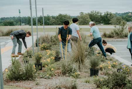 FFA students planting flowers. 