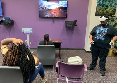 Students play video games during AITS game night.