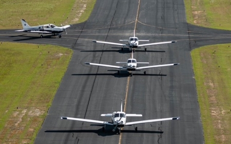 MGA flight instructors creating a finger-four formation.