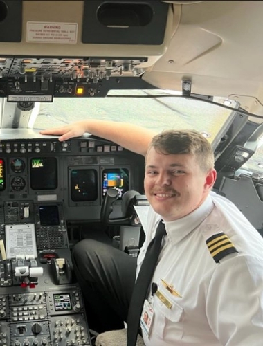 Jacob White poses in the cockpit of an airline jet. Image: daltonga.gov