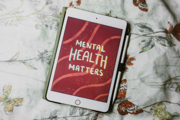 An iPad with the words "mental health matters" on display. 