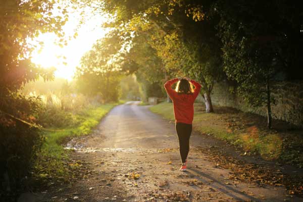 Woman takes a morning jog in the countryside
