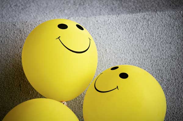 Smiley face balloons. 
