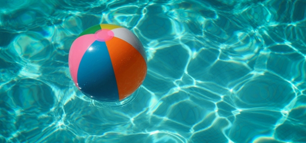 Beach ball floating in a body of water.