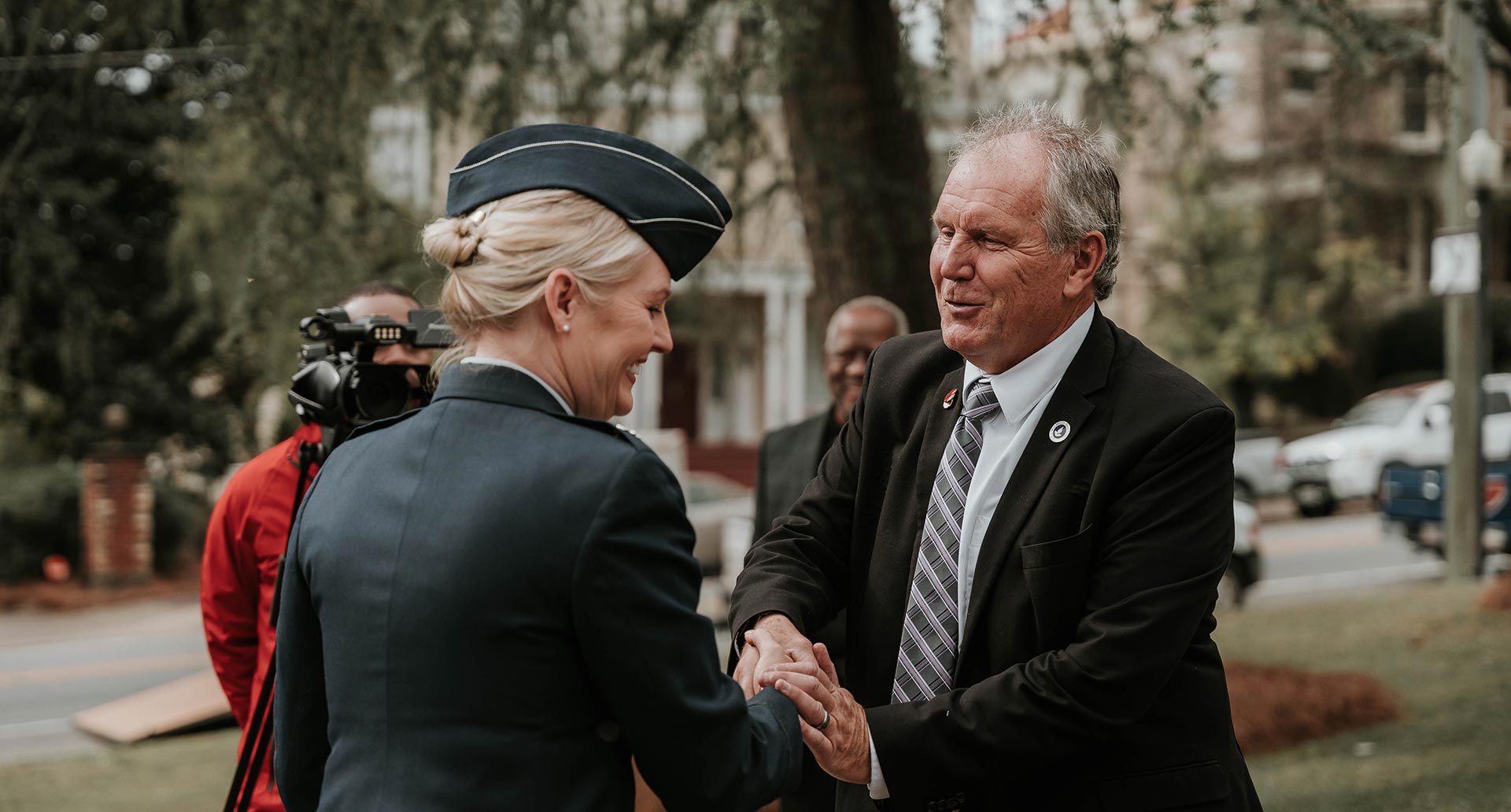 MGA President Chris Blake shakes hands with a Veteran at the 2023 Veterans Day Ceremony at Coleman Hill in downtown Macon.