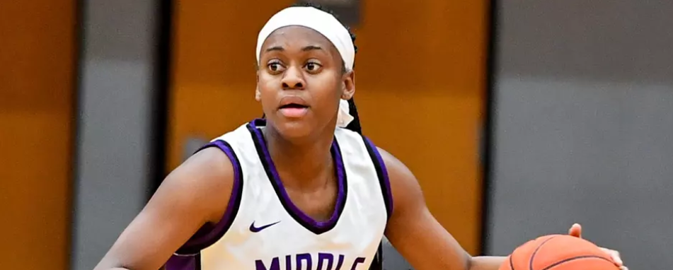 Knights women's basketball player dribbles the ball on the Morris Gym court during a game against the Tornadoes of King University.