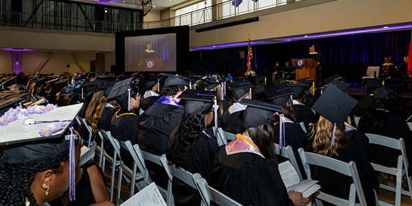 Wide shot of Spring 2026 MGA graduates at commencement.