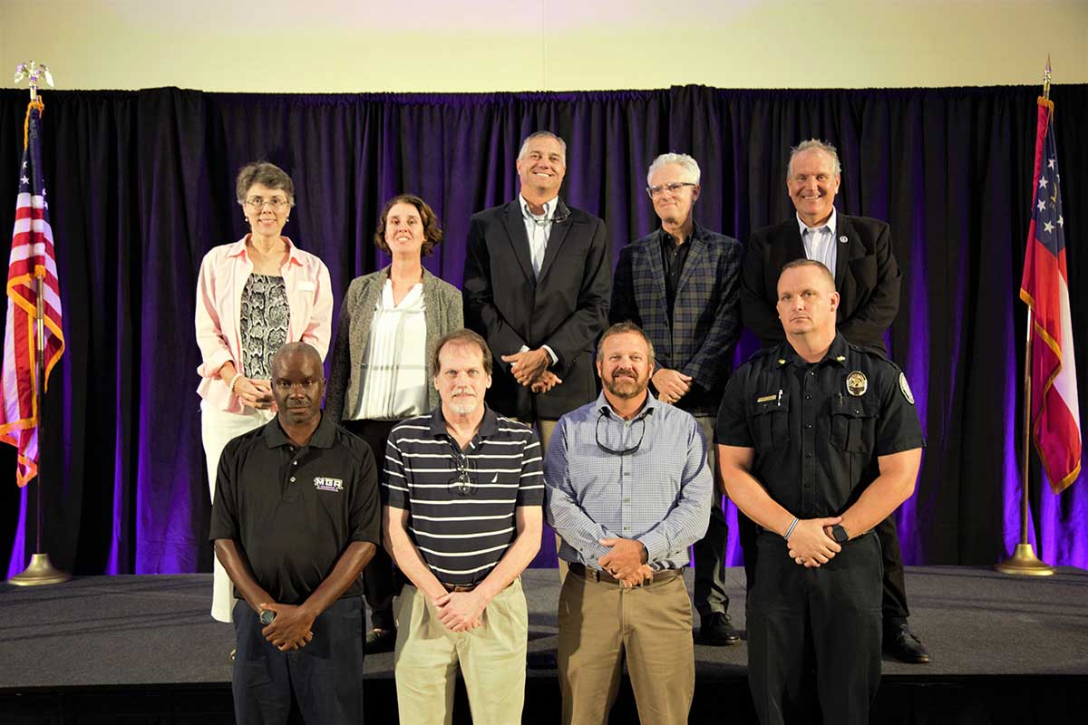 Christopher Blake with 20 years of service honorees.