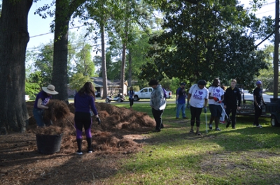 MGA students cleaning the grounds of Cochran's campus.
