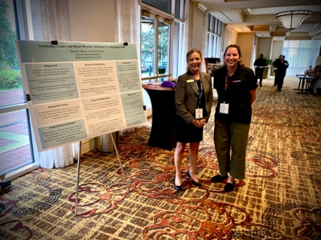 Middle Georgia State University School of Computing’s Department of IT faculty Dr. Kembley Lingelbach (left) and doctoral student Elizabeth Williams (right) waits for U.S. Army Cyber Command Brig. Gen. Paul T. Stanton, Deputy Commanding General (Operations) at Fort Gordon, Augusta (not pictured), to arrive for the start of the research poster presentation at the 2022 TechNet Augusta Research Student Poster Show Wednesday, August 17, 2022, at the Augusta Marriott Hotel and Convention Center. 