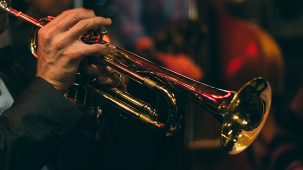 Close up shot of a trumpet player during a performance. 