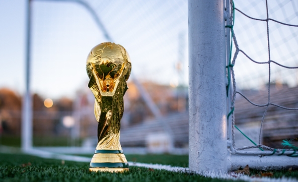 World Cup trophy on a soccer field. 