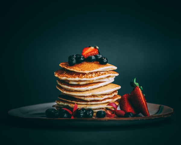 Pancakes with berries on a plate. 
