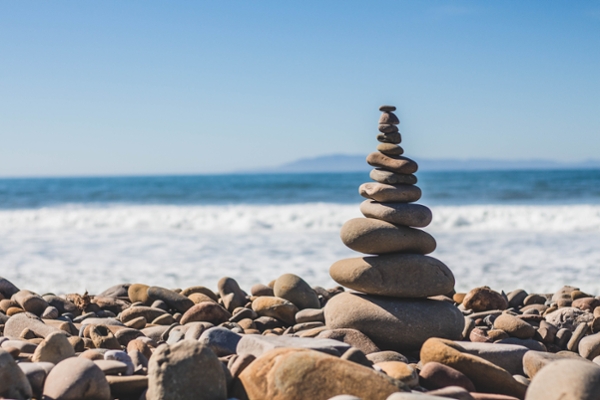 Stacked stones on a beach.