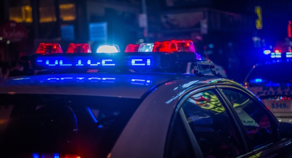 Police car with lights flashing. 