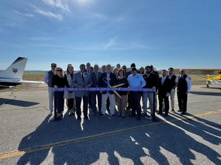 MGA and Macon-Bibb County representatives cut the ribbon at the Macon Downtown Airport runway celebration.