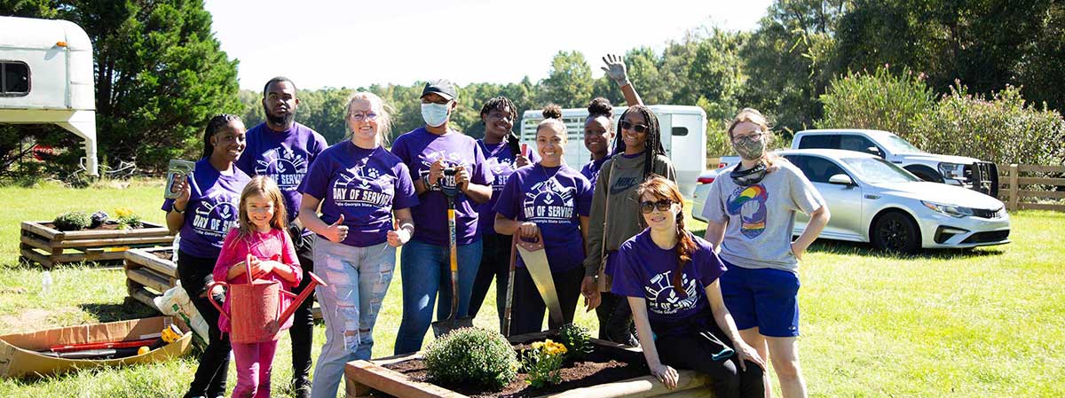 MGA reps planting flowers at the Cochran Equestrian Center. 