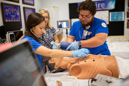 MGA RT students practice in a lab setting.