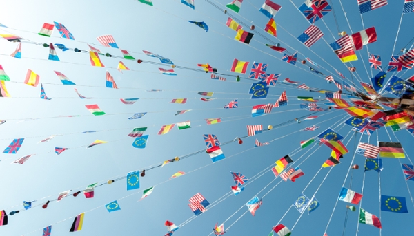 International flags hanging from a rope garland. 