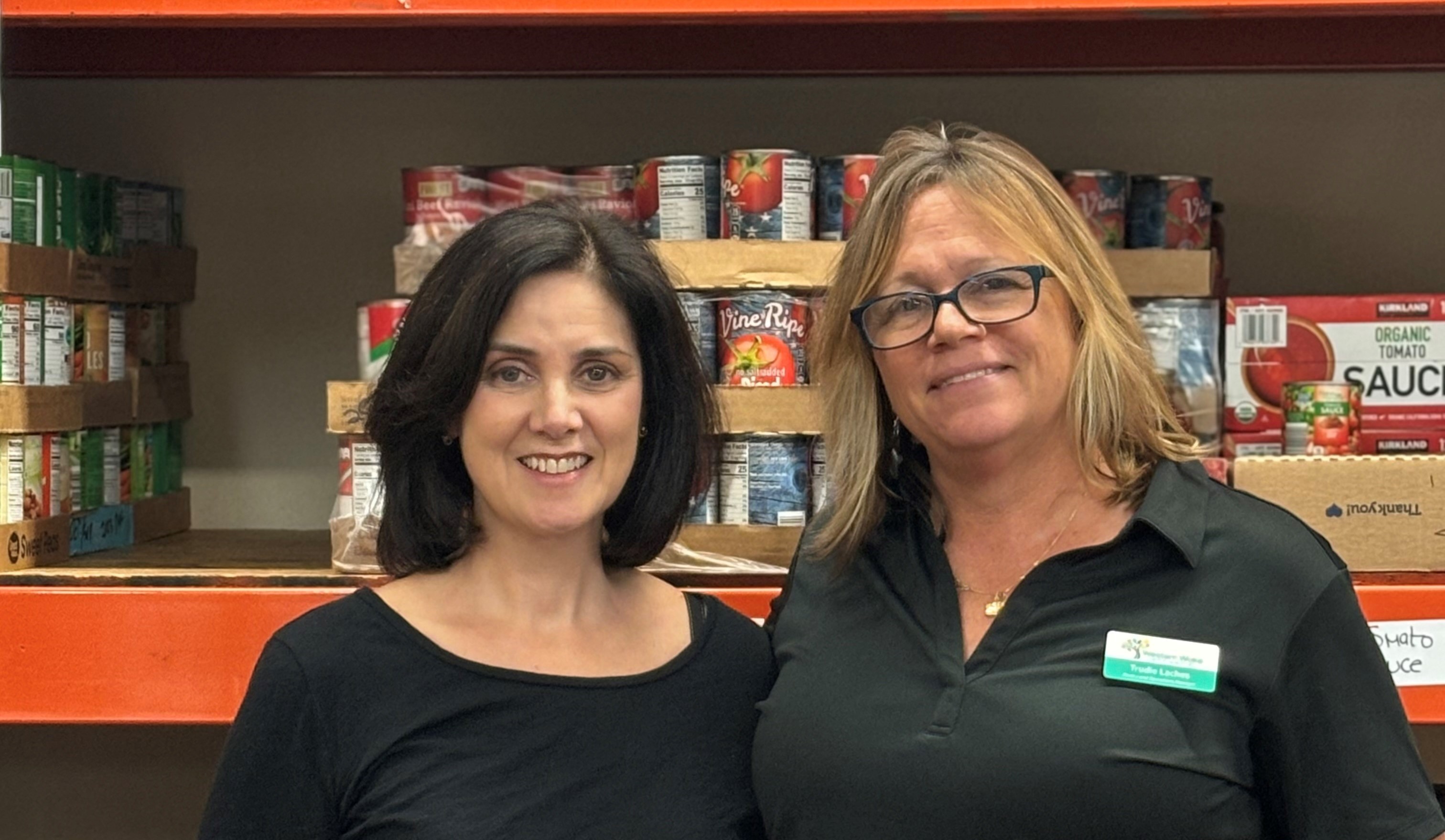 Beth Kennedy, left, with Trudie Laches, manager of the food pantry where Kennedy volunteers.