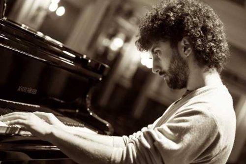 Dr. Giuliano Graniti playing piano.