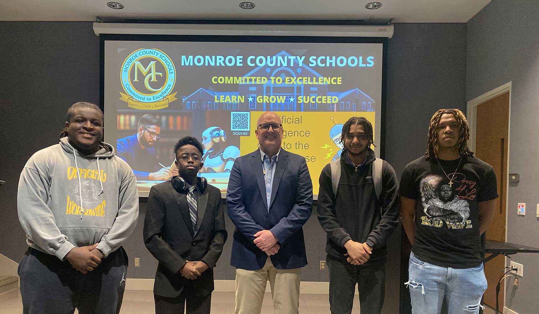 Coach Shipman is pictured with MGA Association of Information Technology students.