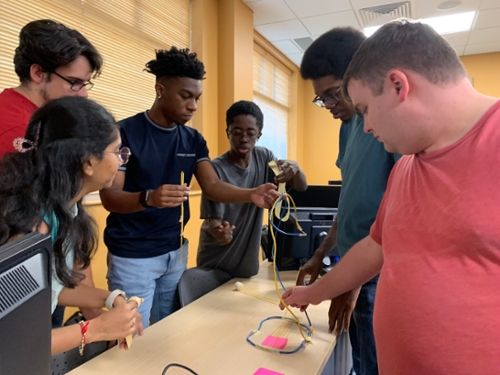 MGA IT students compete in the Marshmallow Challenge.