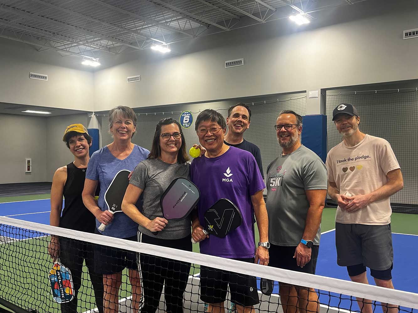 Liz Riley, second from left, shown with some MGA colleagues at the Rhythm and Rally pickleball facility at Macon Mall.