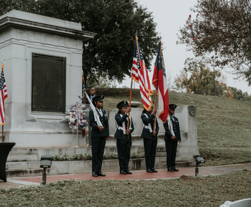 JROTC members carry flags at the ceremony.