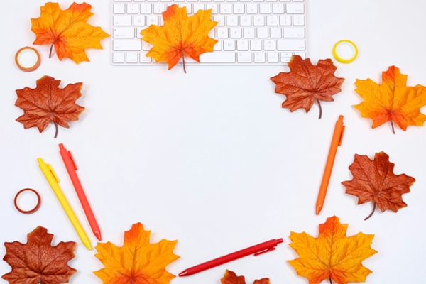 Fall leaves on an office desk.