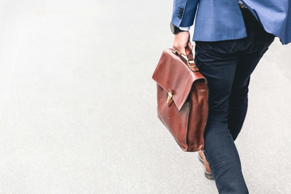 Man holding a briefcase. 