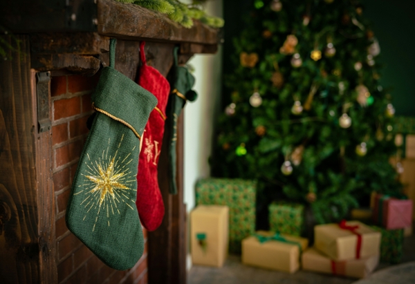 Christmas stockings hanging from a fireplace mantle. 