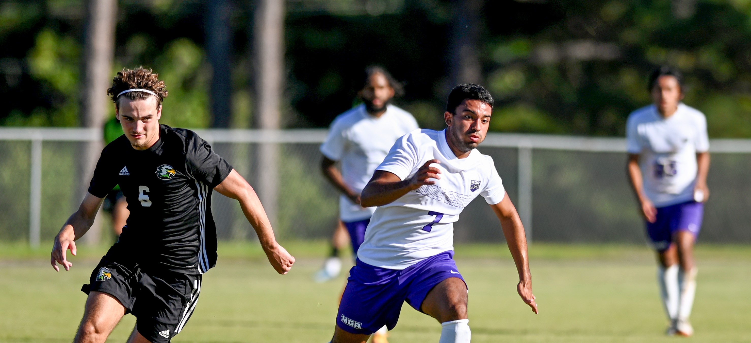 Knights men's soccer player runs down the field. 