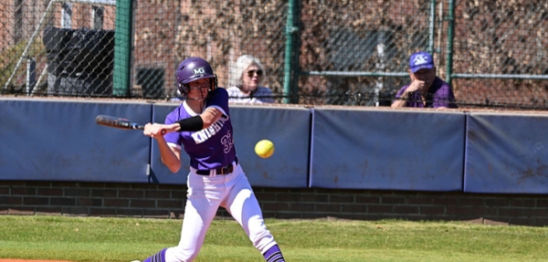Knights softball player hits the ball during a game.