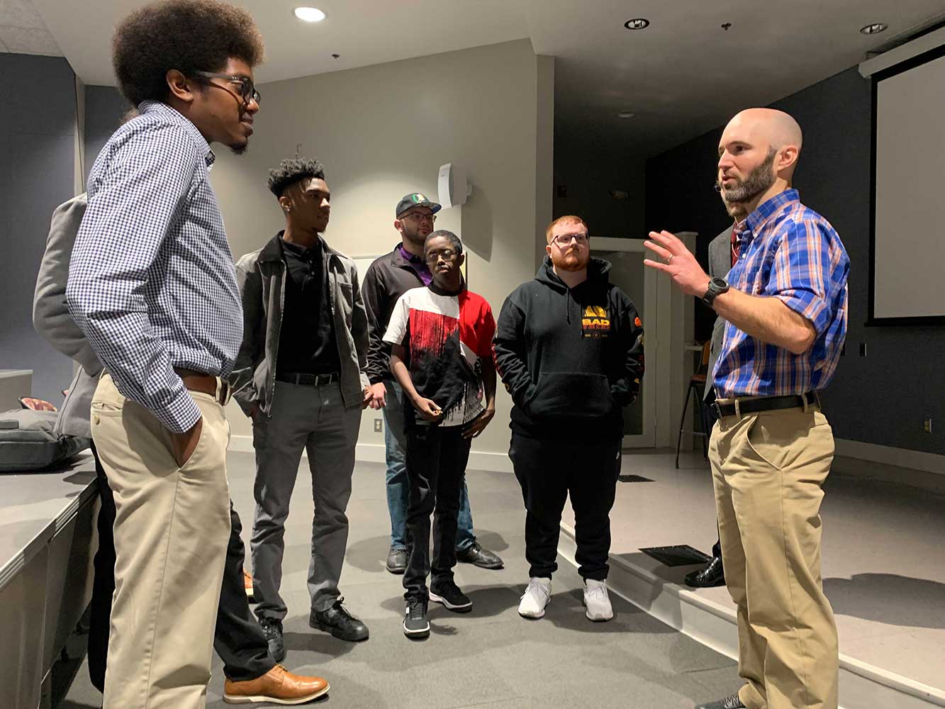 MGA faculty and students speak with Goodman after his lecture.