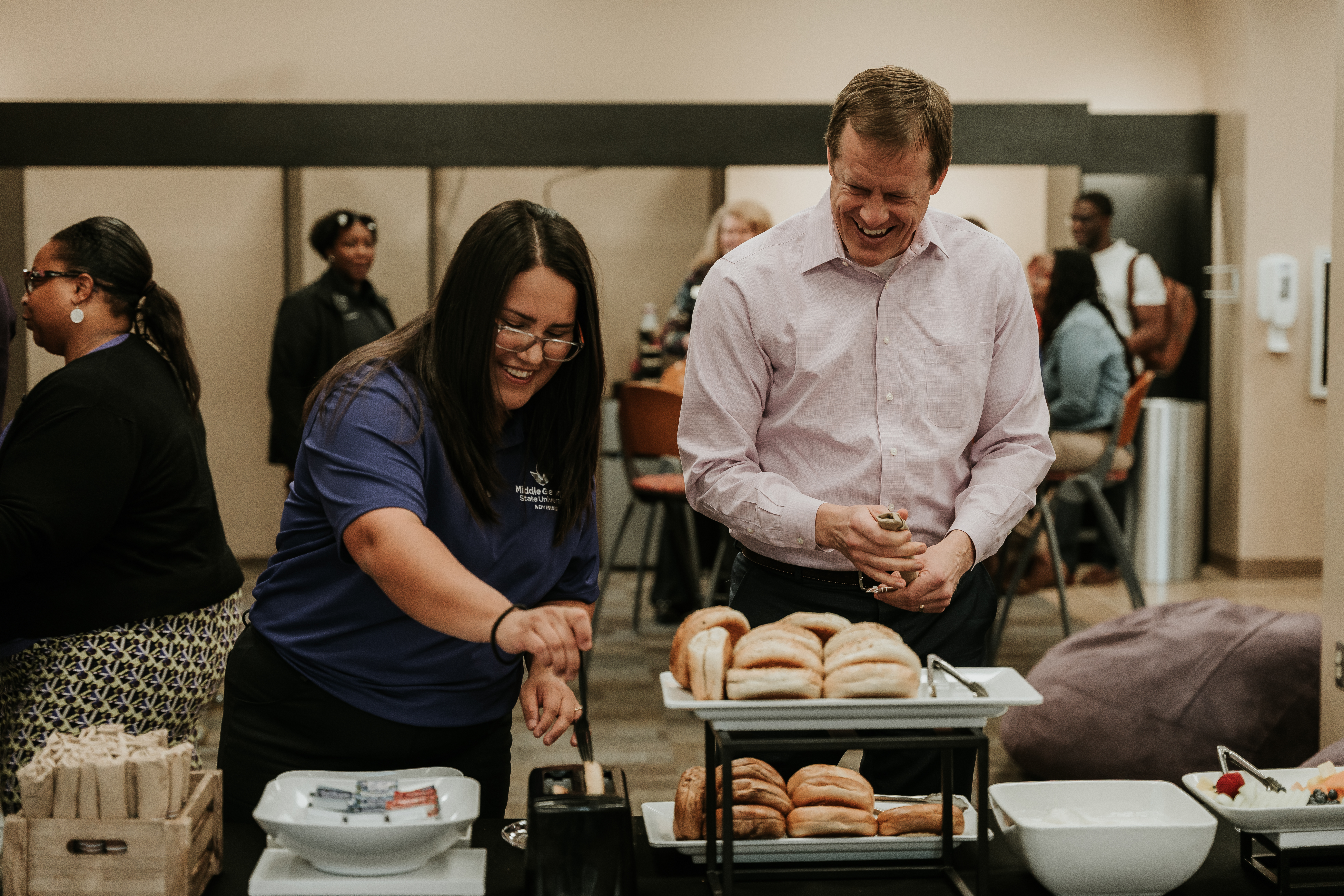 Faculty and staff enjoy bagels and coffee at Blake's Breakfast Bagels in Warner Robins.