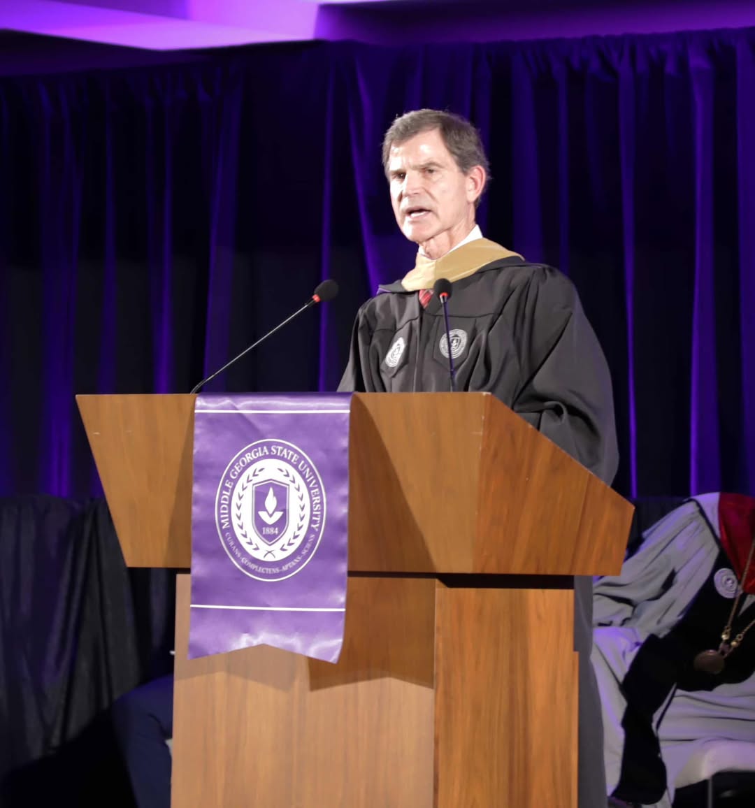 Don Avery speaking at commencement. 