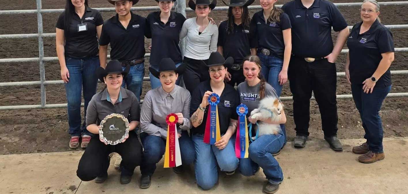 MGA equestrian riders pose with their ribbons at UF show.