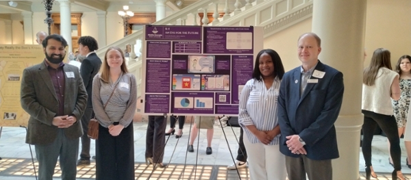 Taylor Reaves and Amya Smith, MGA information technology students from Dr. Karim Feroz's ITEC 3155 class, participated in Posters at the Georgia State Capitol, showcasing their innovative work alongside Dr. Kevin Floyd, associate dean for the School of Computing. 