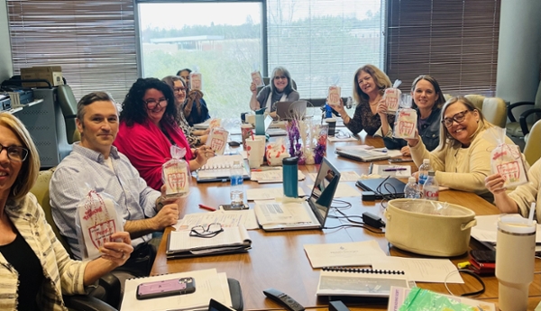 Teacher education faculty sit at a table during their Science of Reading training.