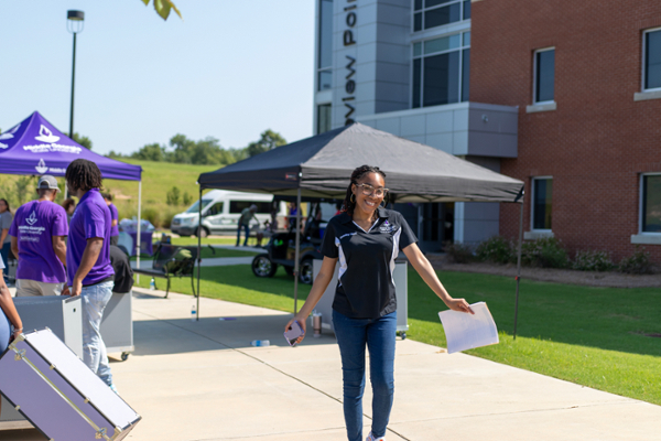 MGA rep welcomes students at Fall 2024 Move-In.