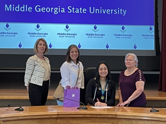 Dr. Rhonda Amerson with a student and her family at Future Georgia Educators Signing Day.