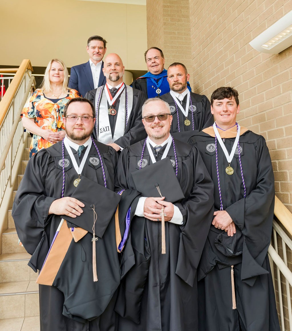 Robins AFB representatives and Dean Marc Miller with the first MGA-Robins strategic partnership cohort at spring commencement.