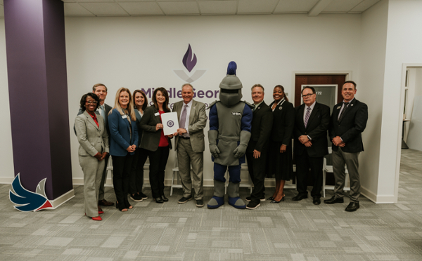 Representatives from MGA and Robins Financial Credit Union pose for a photo at the MOU signing in the Center or Middle Georgia Studies.