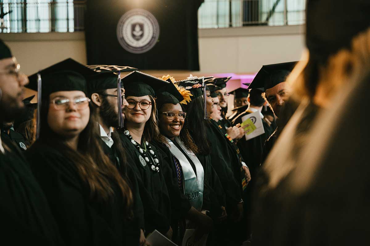 MGA students stand at 2025 Convocation. 