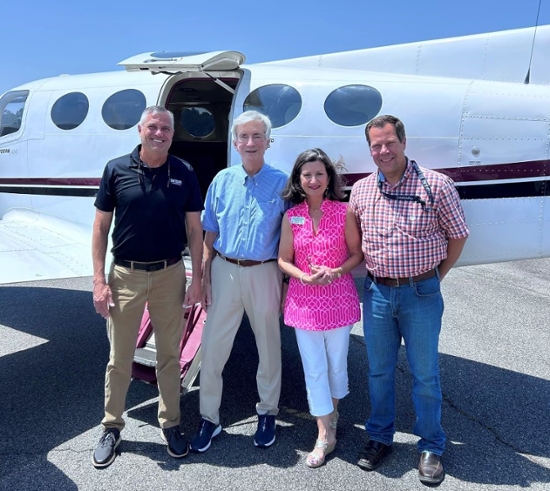 L–R: Adon Clark, dean of the School of Aviation; Marshal Mize, donor; Nancy White, vice president for Advancement; and Keith Clark, pilot.